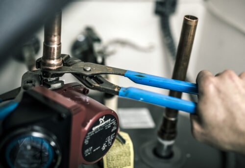Channellock 9.5" Tongue & Groove Pliers, Straight Jaw 420 — In Use Top View Channellock 9.5" Tongue & Groove Pliers, Straight Jaw 420 — gripping pipe fittings plumbing repairs